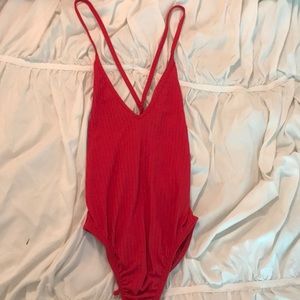 Red open tie back body suit